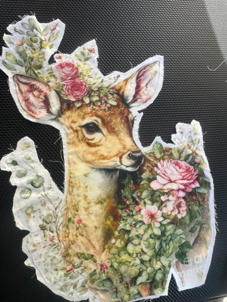 This is a fabric cutout featuring the artwork "Pink Rose Doe" by Tina LeCour. The image is available on various products like beach towels and posters.